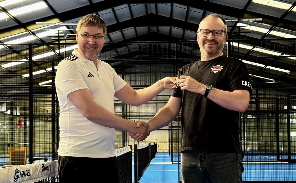 Bill Dixon handing the studio keys to Paul Johnston of CRFM West